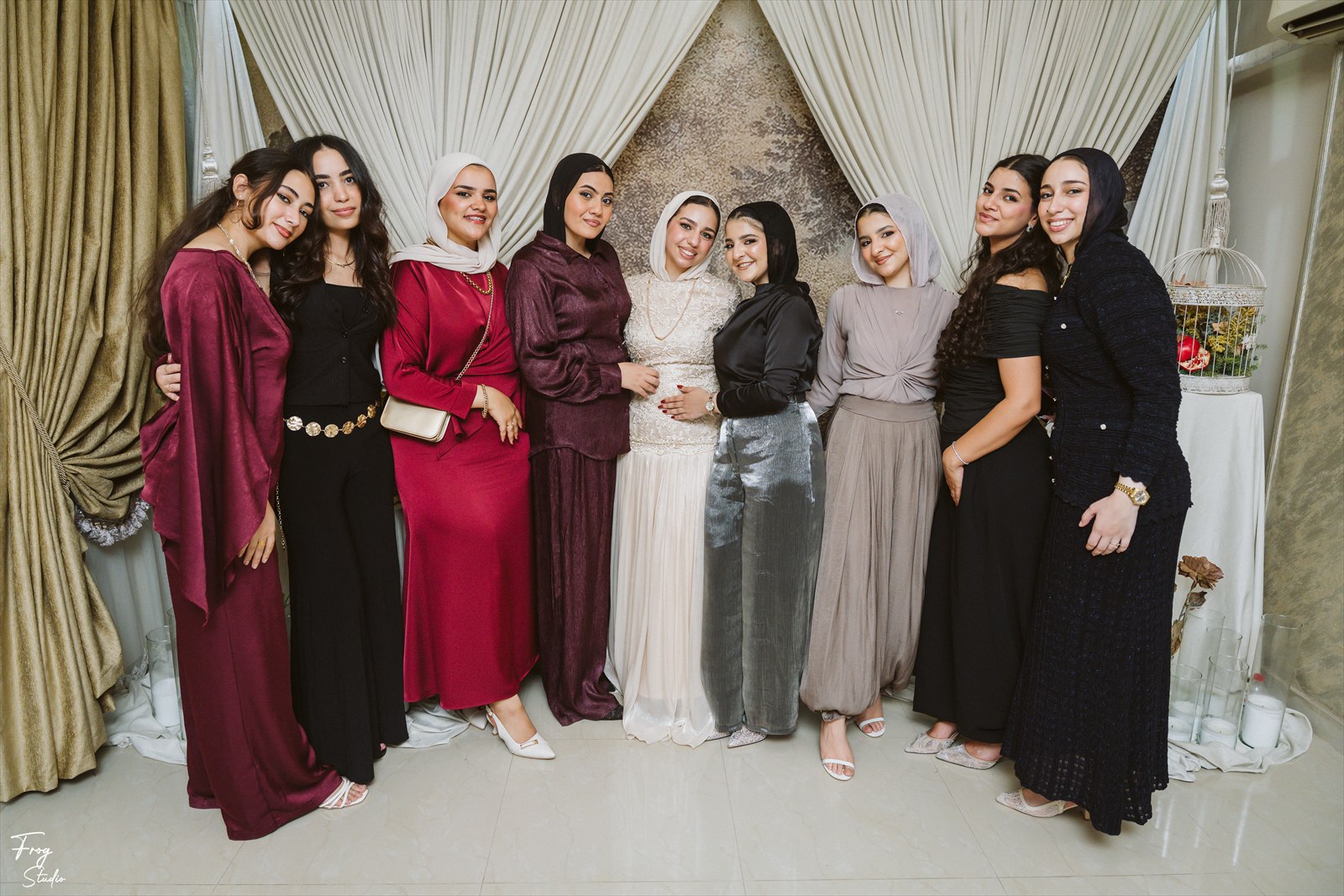 A group of the ladies of the family photographed together in the draped hall