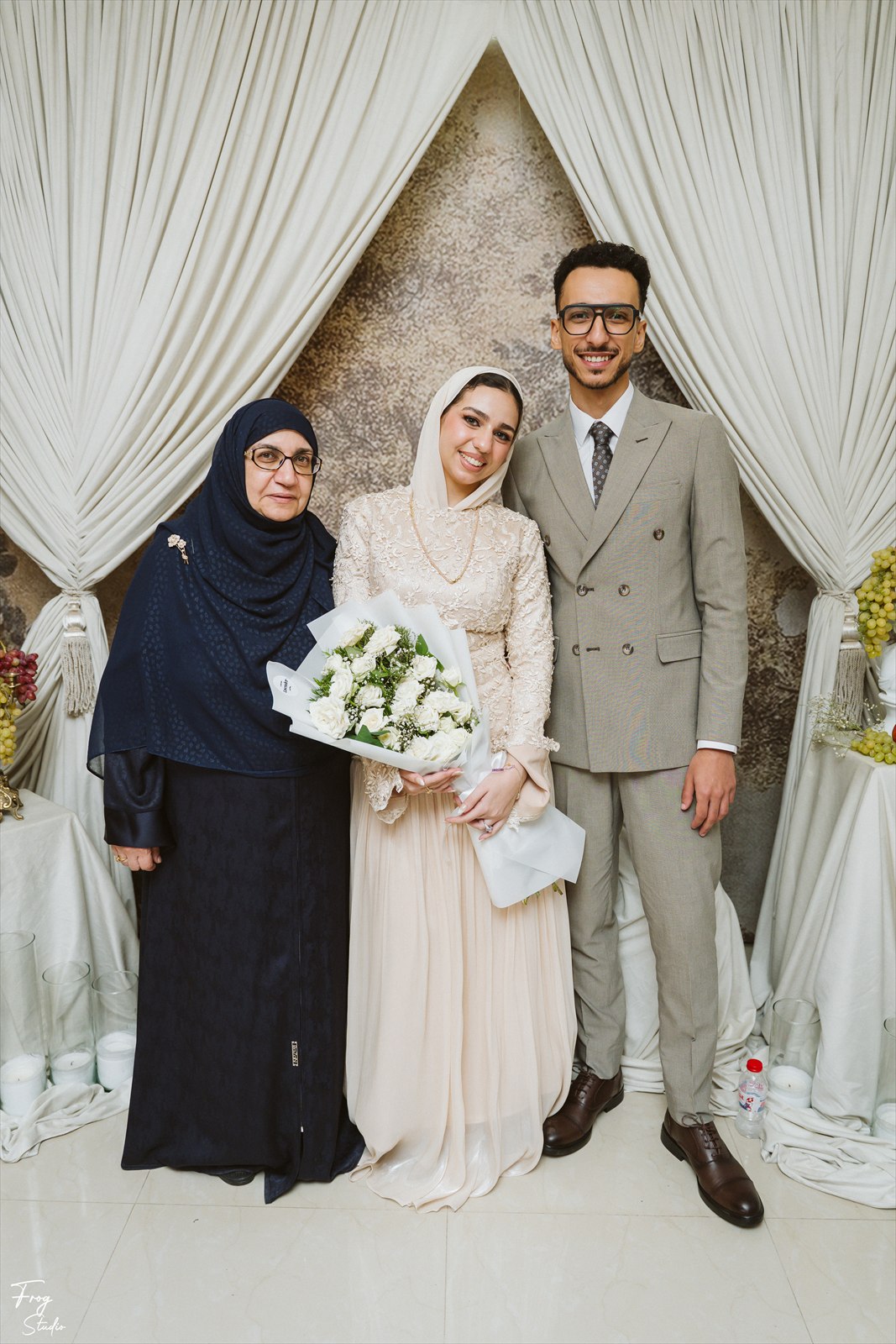 Reem and Mohamed photographed with a family member at the party